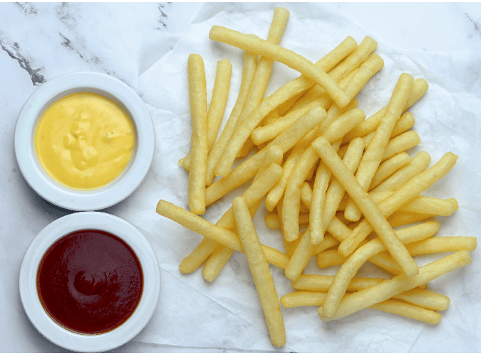  A spoonful of potato dices on a white background .